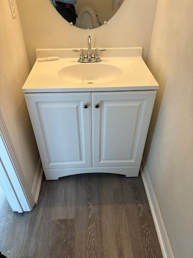 New bathroom vanity installation with modern plumbing fixtures by Kabam Plumbing Services in Sun City Center Florida