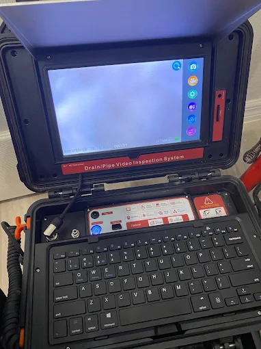 Drain and pipe video inspection system monitor showing sewer camera view - Kabam Plumbing